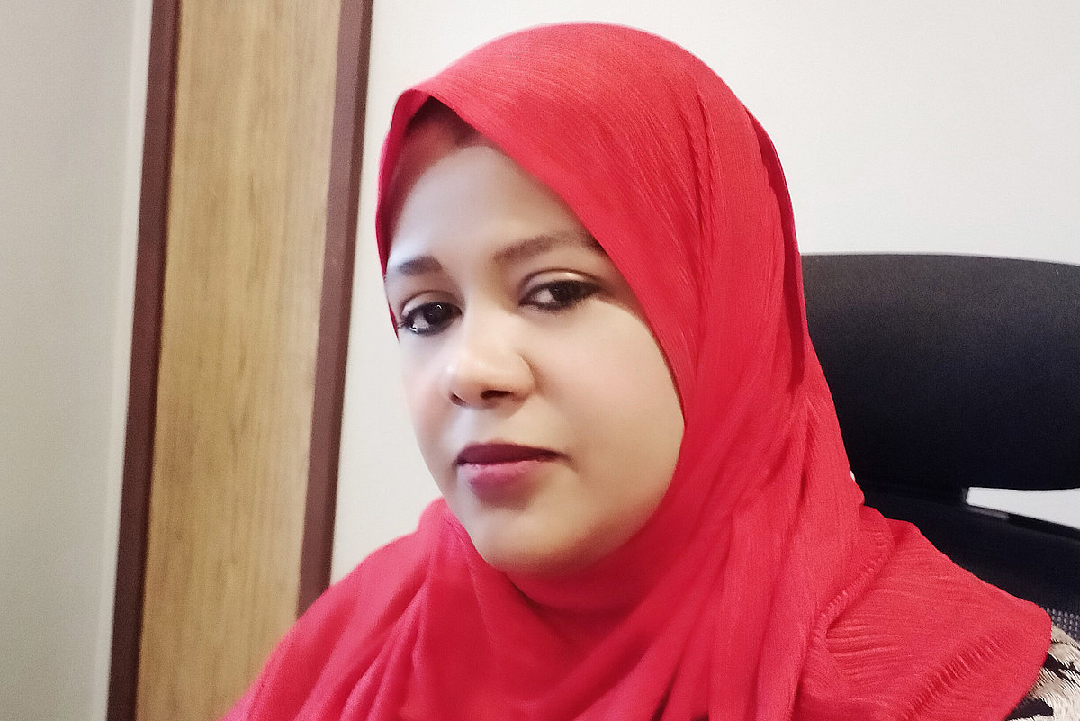 Photo: Kenian doctor Asma Ali Awadh sitting in a chair.