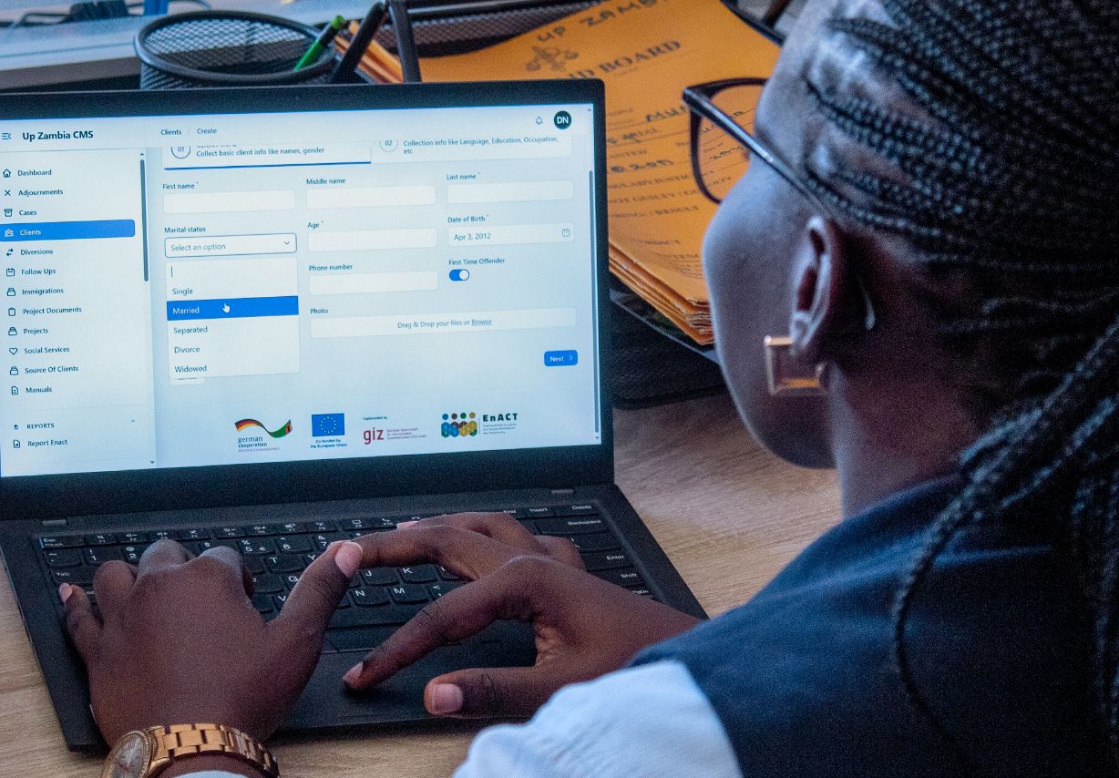 Photo: A woman working on a laptop.