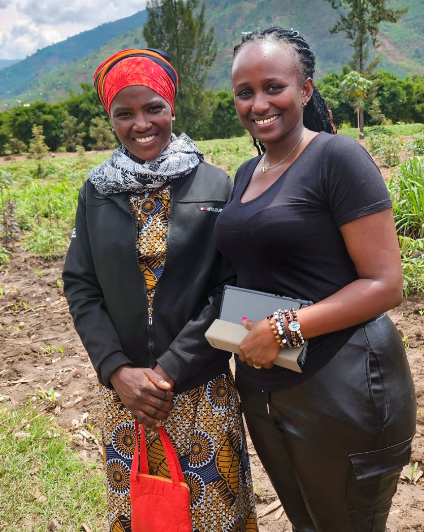 Photo: Two women standing in a rural area.